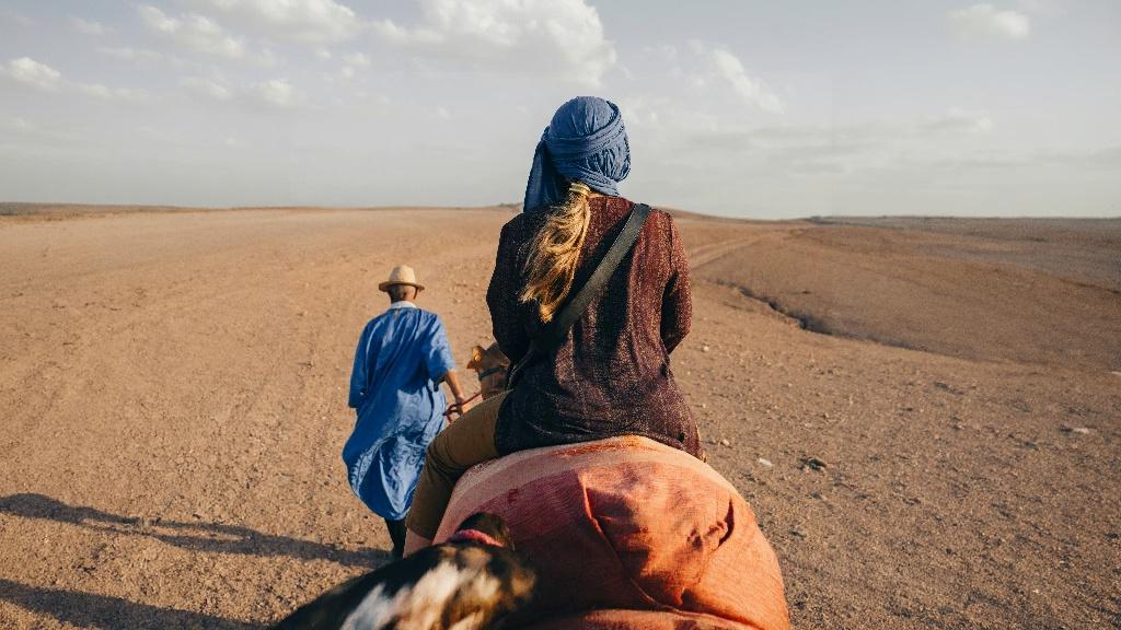 Expanded rider in the desert after AI image expansion